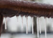 A closeup of a frozen brown pipe