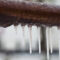 A closeup of a frozen brown pipe